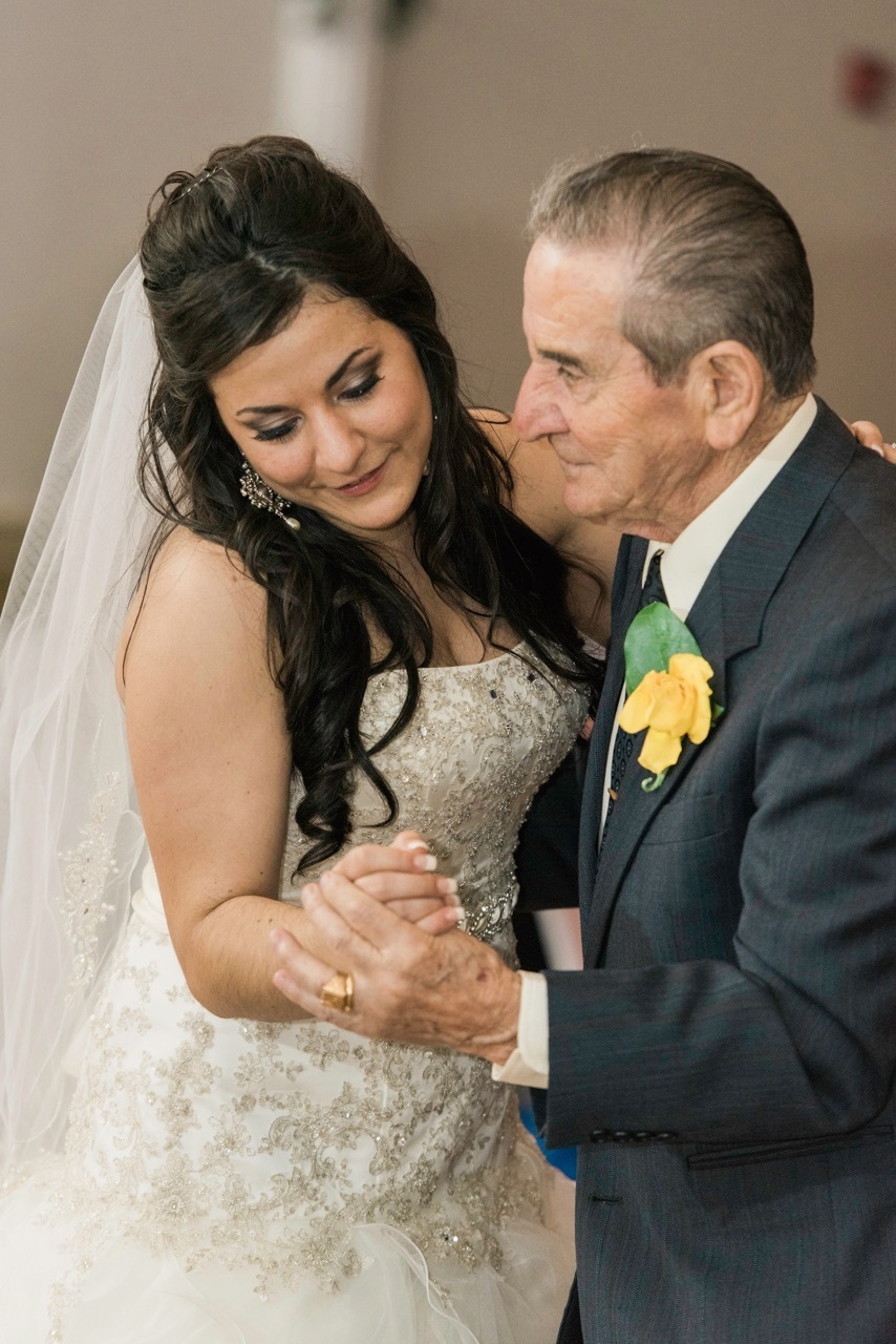 A bride dances with her Grandfather